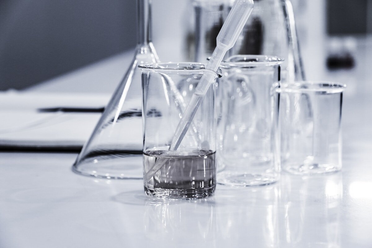 Laboratory beakers and pipette with water samples being tested for PFAS contamination in Australian water